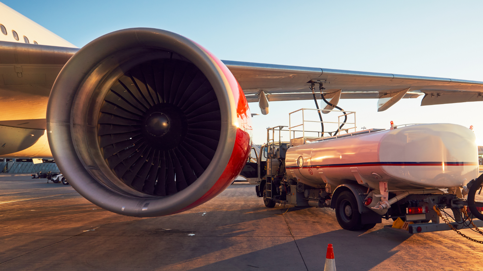 Aircraft being refueled with kerosene from a tanker truck