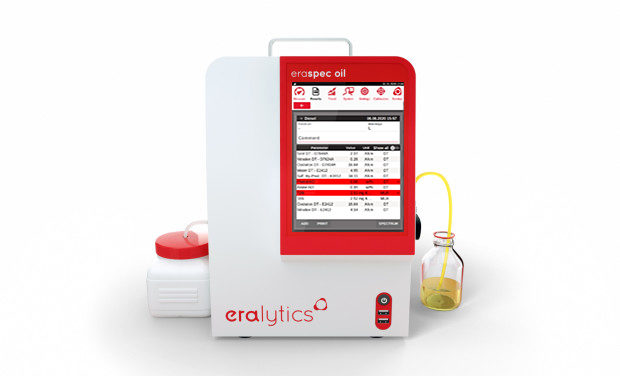 An ERASPEC OIL lube oil analyzer showing the results screen